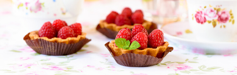 Mini tarts with raspberries fruits
