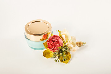 Can with cream and roses.White isolate background.Copy space for text.universal template