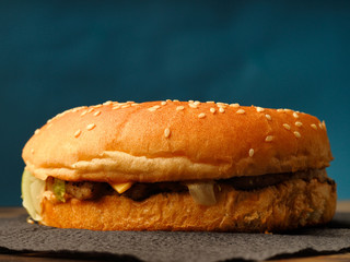 Traditional hamburger on a blue background.