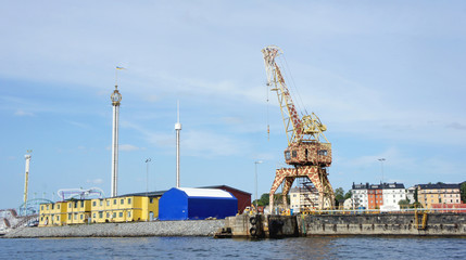 Fototapeta na wymiar Crane giraffe on the jetty, art decor, sunny day, Stockholm, Sweden