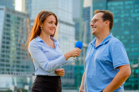 Young girl TV reporter interviews a man