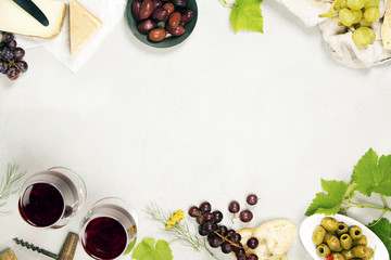 Wine and snack set. Grey marble background, top view, copy space