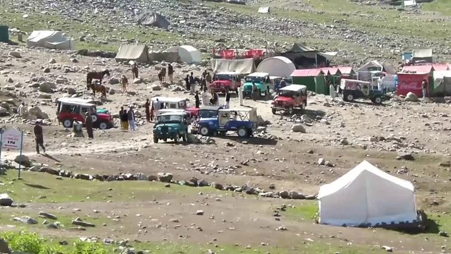 Jeeps Near Road And Tents - Pan - Left To Right 