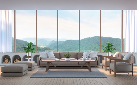 Modern living room with mountain view 3d rendering image. There are wood floor.Furnished with fabric and wooden furniture. There are large window overlooking the surrounding nature and mountain
