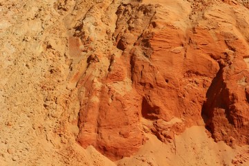  Yellow and orange sand texture of the colored sand cliffs of Rainbow Beach, Australia