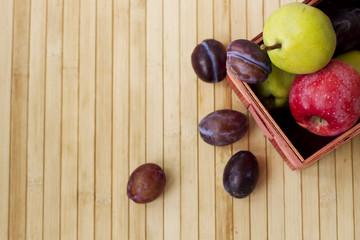 fruit basket on a wooden background