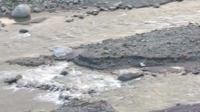River Water Source Flowing Between Rocks - Pan - Right To Left 
