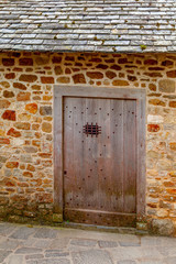 old stone doorway with wooden door