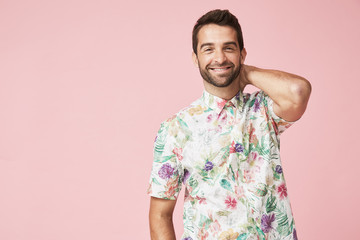 Smiling guy in floral patterned shirt, portrait