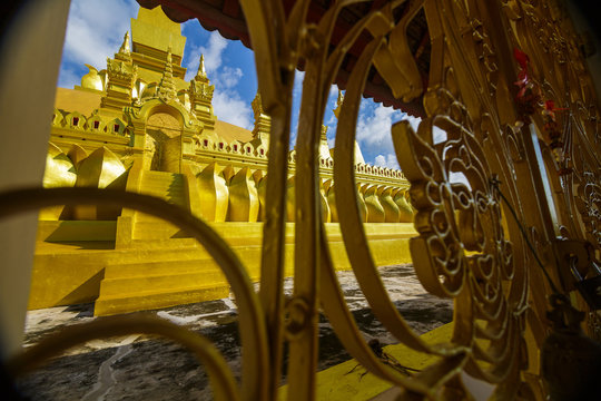 Golden temple gate at Pha That Luang, a Buddhist pagoda in Vientiane, Laos