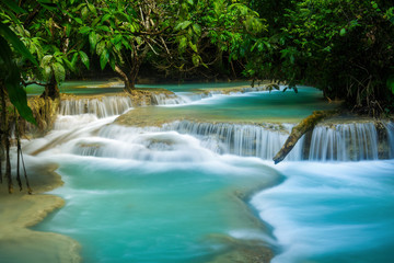 Turquoise water of Kuang Si waterfall in Luang Prabang, Laos