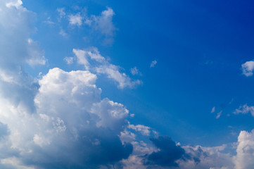 bright blue sky with clouds and sun. cumulus, background, weather.