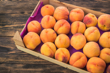 peaches in a wooden box