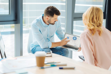 Competent manager explaining working diagram