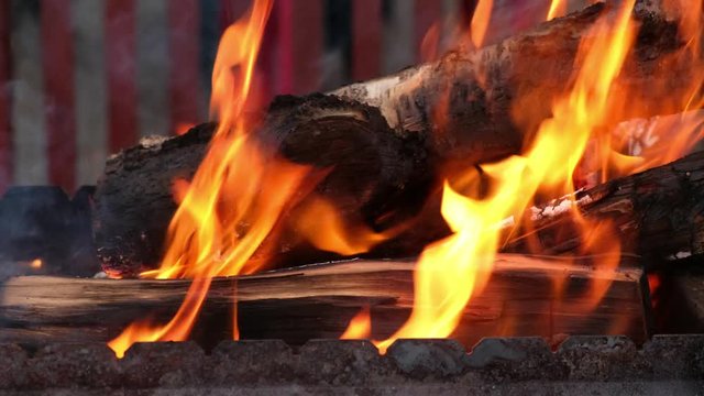 Open fire in iron barbecue stove