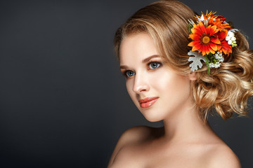 Beautiful woman portrait with flowers in hair. Autumn bride