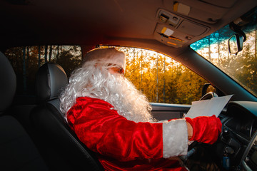 Authentic Santa Claus. Santa Claus drives a car.