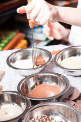 Fototapeta na wymiar Little chef prepare chocolates