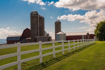 Silos, Barns and a White Fence