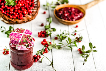 Berry jam in a jar on table, natural organic food - homemade preserve for winter