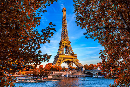 Paris Eiffel Tower and river Seine in Paris, France. Eiffel Tower is one of the most iconic landmarks of Paris. Autumn Paris.