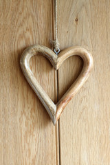 Wooden heart on wood