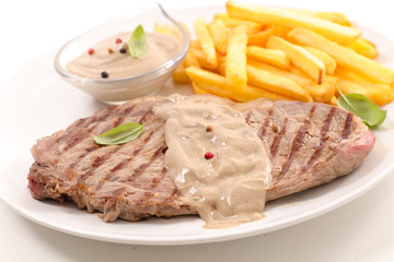 fried beef steak with pepper sauce and french fries