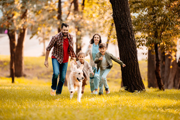 family running after dog - Powered by Adobe
