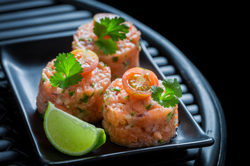 Delicious salmon tartare with coriander and lime