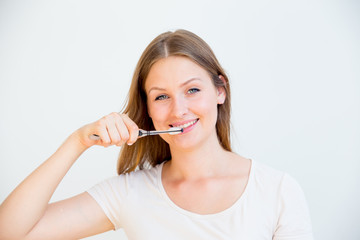 Girl is brushing teeth