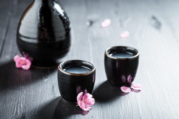 Prepared to drink sake in old black ceramics © shaiith