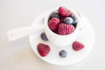 Healthy mixed fruit and ingredients with strawberry, raspberry, blueberry, blackberry from top view
