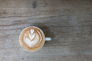 Cappuccino white glass placed on wood