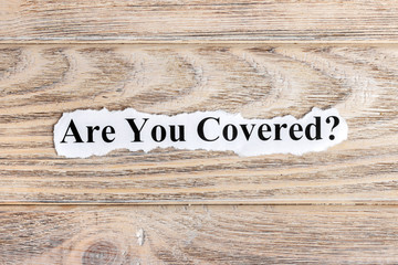 Are You Covered text on paper. Word Are You Covered on torn paper. Concept Image