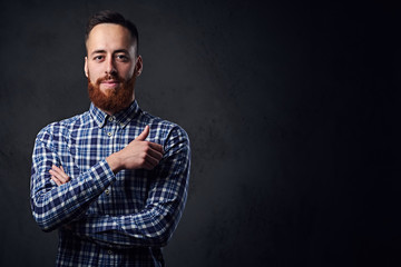 A man with crossed arms, dressed in a blue fleece shirt.