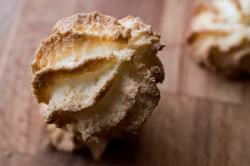 Coconut Cookies on wooden surface.