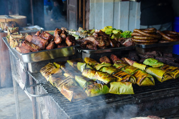 Steamed fish with curry paste in banana leaves wrap (thai food), grilling