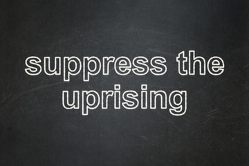 Obraz premium Politics concept: Suppress The Uprising on chalkboard background