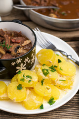 Creamy potatoes boiled with milk and parsley