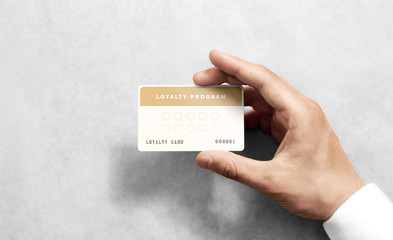 Hand hold loyalty card template with rounded corners. Plain reward namecard mock up holding arm....