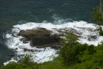 Sea waves crashing over rocks