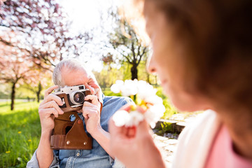 Obraz premium Beautiful senior couple in love outside in spring nature.