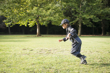 Fototapeta premium Little girl running in police costume