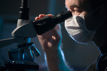 Doctor examines patient tissue samples