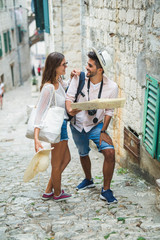 Tourist couple enjoying sightseeing and exploring city