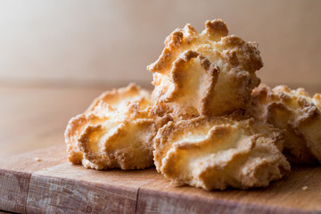 Coconut Cookies on wooden surface.