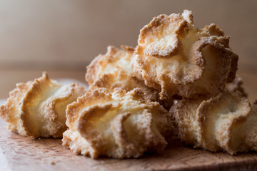 Coconut Cookies on wooden surface.