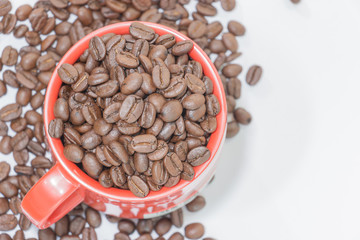 ground coffee and coffee beans on white background