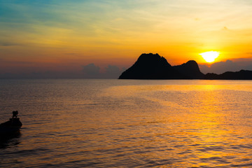 Bright colors at dawn on the beach at sunrise in the Gulf of Thailand.