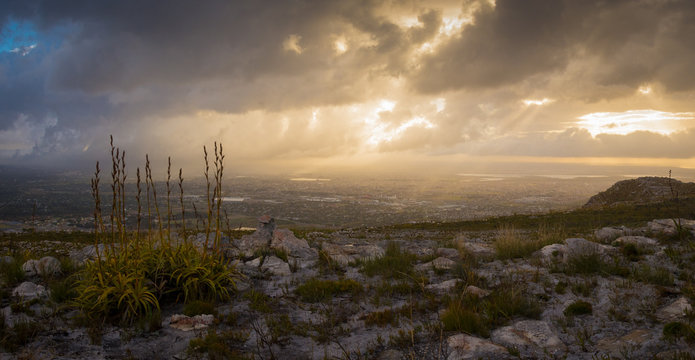The sun rises over the city on a stormy morning 